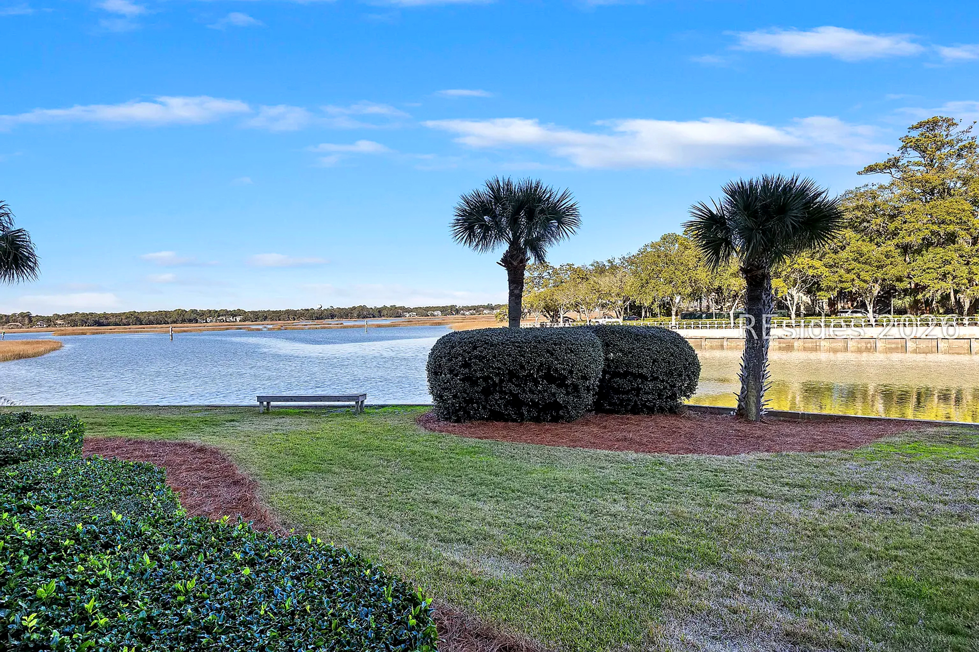 Gentle ripples on the water and swaying palms create a serene backdrop for quiet mornings on the lawn. Settle onto the wooden bench to watch the sky turn brilliant gold as the afternoon glow settles over the marsh.