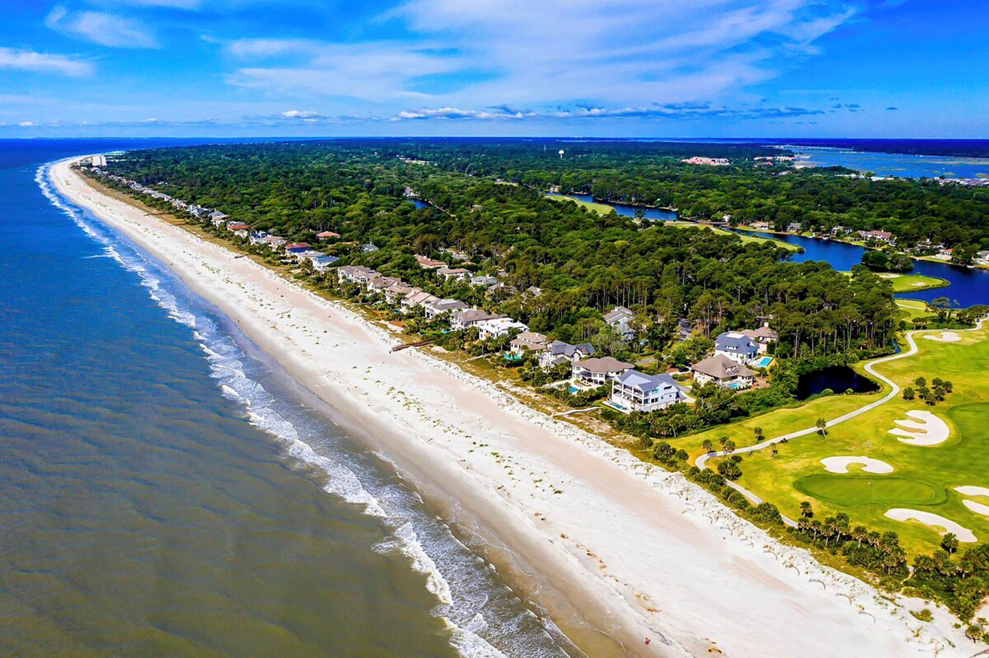 Pristine coastal dunes meet the rhythmic pulse of the Atlantic in this aerial view of your island getaway. Soft sands and emerald fairways create a stunning backdrop for slow mornings and salty afternoon breezes.